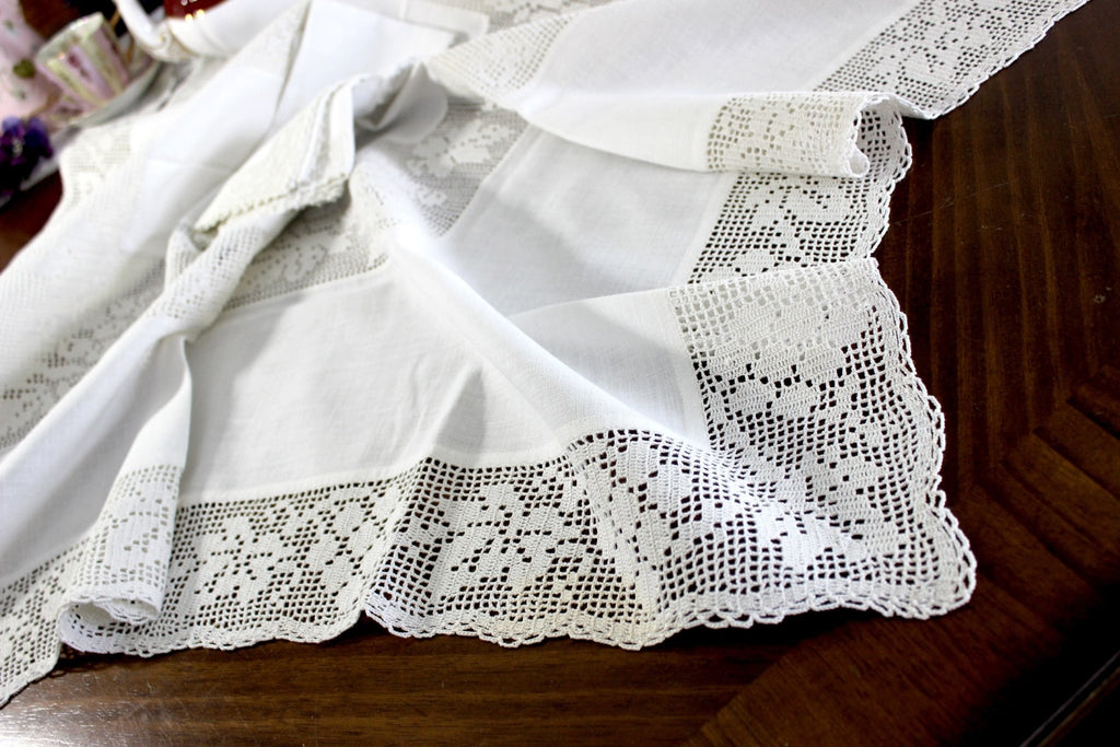 https://thevintageteacup.us/cdn/shop/products/antique-tablecloth-linen-table-cloth-handmade-filet-crocheted-accent-and-edges-15031tablecloththe-vintage-teacup-871134_1024x1024.jpg?v=1682009319